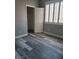 Bedroom with wood-look floors, white shutters, and an ensuite closet at 8125 Rio De Janeiro Dr, Las Vegas, NV 89128