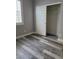 Bedroom featuring wood-look floors and a closet with a white door at 8125 Rio De Janeiro Dr, Las Vegas, NV 89128