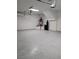 Spacious two car garage with sealed flooring, water heater, and water filtration system at 8125 Rio De Janeiro Dr, Las Vegas, NV 89128