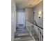 Hallway with gray walls, wood-look floors and white banister at 8125 Rio De Janeiro Dr, Las Vegas, NV 89128