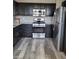 Contemporary kitchen featuring stainless steel appliances and dark cabinetry at 8125 Rio De Janeiro Dr, Las Vegas, NV 89128