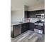 Well-equipped kitchen with stainless steel appliances, dark cabinetry, and granite countertops at 8125 Rio De Janeiro Dr, Las Vegas, NV 89128