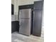 Kitchen features stainless steel refrigerator and appliances against dark cabinetry at 8125 Rio De Janeiro Dr, Las Vegas, NV 89128