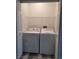Laundry room with a white washer and dryer and utility shelf at 8125 Rio De Janeiro Dr, Las Vegas, NV 89128