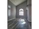 Bright living room with gray-toned wood floors, plantation shutters, and lots of natural light at 8125 Rio De Janeiro Dr, Las Vegas, NV 89128