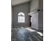 Bright living room with gray-toned wood floors, plantation shutters, and lots of natural light at 8125 Rio De Janeiro Dr, Las Vegas, NV 89128