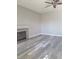 Bright living room featuring wood floors, neutral walls, and ceiling fan at 8125 Rio De Janeiro Dr, Las Vegas, NV 89128