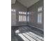 Living room featuring wood-look floors, plantation shutters, and natural light at 8125 Rio De Janeiro Dr, Las Vegas, NV 89128