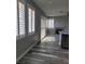 Open-concept living room with wood floors, plantation shutters, and sleek fireplace at 8125 Rio De Janeiro Dr, Las Vegas, NV 89128