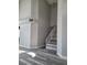 Entryway featuring wood-look floors, modern stairs with white railing, and soaring ceilings at 8125 Rio De Janeiro Dr, Las Vegas, NV 89128