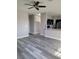 Open concept living space featuring kitchen, staircase, and modern flooring at 8125 Rio De Janeiro Dr, Las Vegas, NV 89128