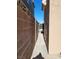 Narrow side yard walkway with block wall for privacy, leading to backyard at 8125 Rio De Janeiro Dr, Las Vegas, NV 89128