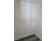 A bright walk-in closet features shelving and modern grey wood floors at 8125 Rio De Janeiro Dr, Las Vegas, NV 89128