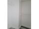 The well-lit walk-in closet is equipped with shelving and modern grey wood floors at 8125 Rio De Janeiro Dr, Las Vegas, NV 89128