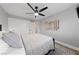 Neutral bedroom with a black bed frame, and accent wall art at 8985 Tierra Santa Ave, Las Vegas, NV 89129