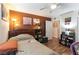 This bedroom features a ceiling fan and a door that leads to a common living space at 9293 Boltonia Ct, Las Vegas, NV 89149