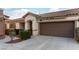 Charming single-story home with a tile roof and attached two-car garage at 9293 Boltonia Ct, Las Vegas, NV 89149