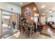 View of a dining area connecting the living room with a sliding glass door to the patio at 9293 Boltonia Ct, Las Vegas, NV 89149