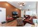 Comfortable living room with a ceiling fan and neutral walls at 9293 Boltonia Ct, Las Vegas, NV 89149