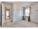Bedroom featuring a closet, carpet flooring, a desk, and an adjacent hallway at 933 Monte Nerone Ave, Henderson, NV 89012