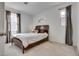 Comfortable bedroom with soft carpet, natural light, and neutral-toned curtains at 933 Monte Nerone Ave, Henderson, NV 89012