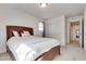 Bedroom with carpet flooring, wood bed frame, and an entrance to the hallway at 933 Monte Nerone Ave, Henderson, NV 89012