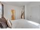 Bright bedroom with carpeted floors, natural light, and a view through an open door at 933 Monte Nerone Ave, Henderson, NV 89012