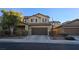 Charming two-story home featuring a well-manicured front yard and inviting curb appeal at 933 Monte Nerone Ave, Henderson, NV 89012