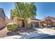 Inviting front exterior showcasing desert landscaping and a covered entryway with decorative details at 933 Monte Nerone Ave, Henderson, NV 89012