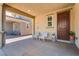 Welcoming front porch with seating, providing a relaxing outdoor space and charming entryway at 933 Monte Nerone Ave, Henderson, NV 89012