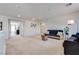 Spacious living room with soft carpet, neutral walls, and ample seating at 933 Monte Nerone Ave, Henderson, NV 89012