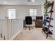 Upstairs office space with natural light, neutral walls, and furniture at 933 Monte Nerone Ave, Henderson, NV 89012