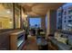 Relaxing balcony features comfortable seating, an electric fireplace, and city views at 1 Hughes Center Dr # 308, Las Vegas, NV 89169