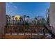 Outdoor balcony featuring views of the city and palm trees at 1 Hughes Center Dr # 308, Las Vegas, NV 89169