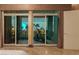 Bedroom with floor to ceiling sliding doors leading to the balcony and city views at 1 Hughes Center Dr # 308, Las Vegas, NV 89169