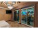 Bedroom featuring access to balcony with beautiful city views at 1 Hughes Center Dr # 308, Las Vegas, NV 89169