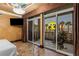 Bedroom with doors leading to balcony with city views at 1 Hughes Center Dr # 308, Las Vegas, NV 89169