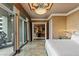 Opulent bedroom featuring marble floors, decorative ceiling, and balcony access at 1 Hughes Center Dr # 308, Las Vegas, NV 89169