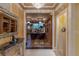 Foyer with elegant art leading into an office space with city views at 1 Hughes Center Dr # 308, Las Vegas, NV 89169