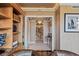 Long hallway with elegant lighting and decor leading to other rooms, showcasing upscale design at 1 Hughes Center Dr # 308, Las Vegas, NV 89169