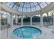 Relaxing hot tub under a decorative dome, surrounded by pillars, offers a serene escape at 1 Hughes Center Dr # 308, Las Vegas, NV 89169