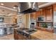 Chef's kitchen with high-end appliances, custom cabinetry, and large center island at 1 Hughes Center Dr # 308, Las Vegas, NV 89169