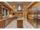 Gourmet kitchen featuring custom cabinets, stainless steel appliances, and a center island at 1 Hughes Center Dr # 308, Las Vegas, NV 89169