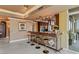 Modern kitchen bar with stylish stools, decorative lighting, and stainless steel appliances at 1 Hughes Center Dr # 308, Las Vegas, NV 89169