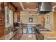 Contemporary kitchen featuring stainless appliances, stylish bar, and granite counters at 1 Hughes Center Dr # 308, Las Vegas, NV 89169