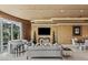 Cozy living room featuring a plush sofa and a mounted flat-screen television at 1 Hughes Center Dr # 308, Las Vegas, NV 89169