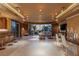 Bright living room with floor-to-ceiling windows, modern lighting, and a bar area for entertaining guests at 1 Hughes Center Dr # 308, Las Vegas, NV 89169