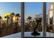 Living room view showcasing city buildings through large windows at 1 Hughes Center Dr # 308, Las Vegas, NV 89169