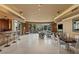 Spacious living room with floor-to-ceiling windows and stylish marble floors at 1 Hughes Center Dr # 308, Las Vegas, NV 89169