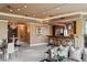 Grand living room with chandelier, and direct access to the bar and kitchen at 1 Hughes Center Dr # 308, Las Vegas, NV 89169